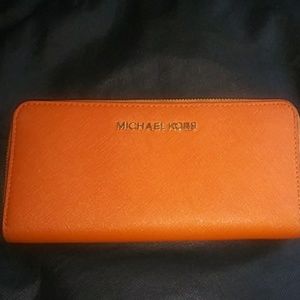Michael Kors large wallet.